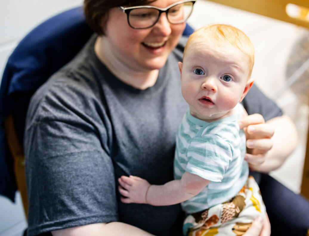 LeafSpring School teacher with infant